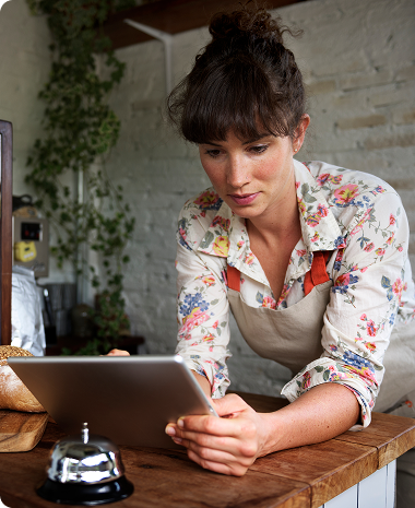 woman reading a financial chart on a tablet